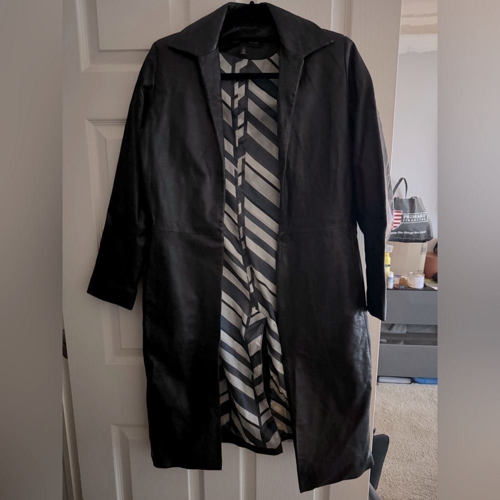 Black mid-length leather jacket